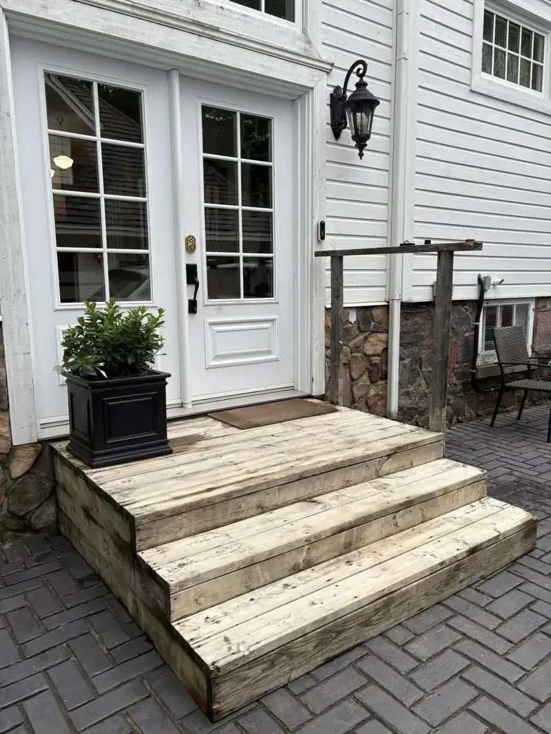 Front porch decking after pressure washing — clean, bright restored boards